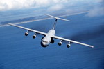 A C-141 from McChord AFB, Washington, flies over the Pacific during Excercise Rodeo '94, on 16 June 1994. (USAF/SrA Andy Dunaway)