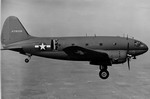 A Curtiss C-46D Commando with both paratroop doors open. (USAF)