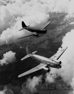 Two Curtiss C-46As in flight. (USAF)