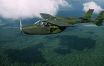 A Cessna O-2A observation aircraft flying over the Empire Range near Howard Air Force Base, Panama, on 8 September 1983. It is assigned to the 24th Composite Squadron of the US Air Force. (DoD)