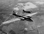 The high altitude Martin RB-57D with the smaller-winged B-57B in the background (USAF)