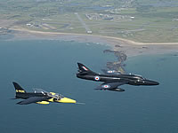 A Gnat making an interesting comparison next to a Hawker Hunter